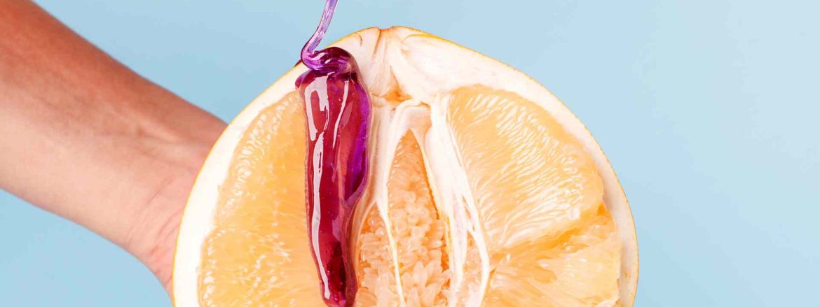citrusfrugt med voks dryppende ned